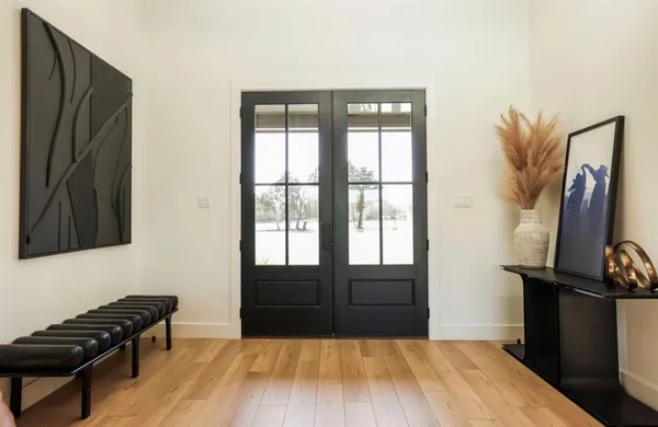 a living room with fireplace furniture and a flat screen tv