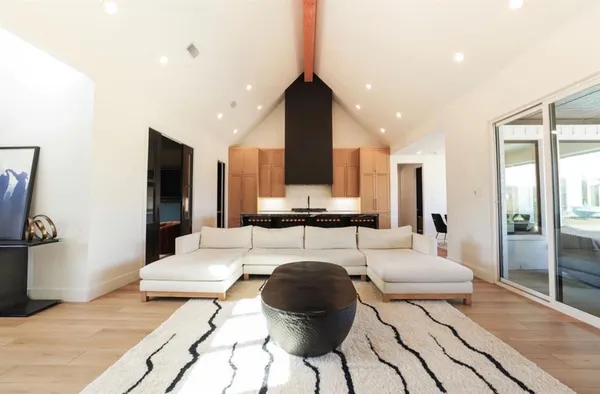 a living room with furniture and a window