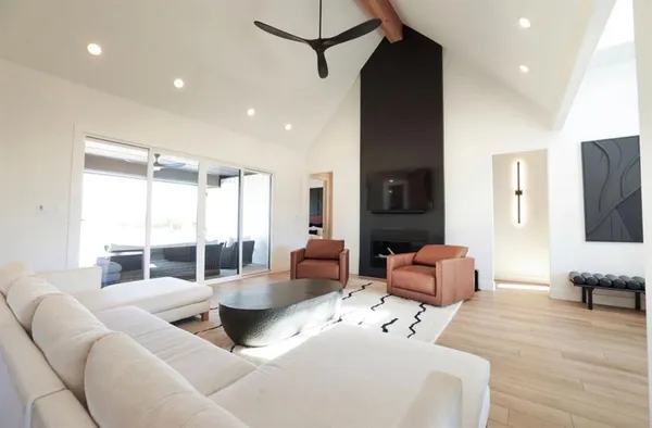 a kitchen with a table chairs sink and cabinets