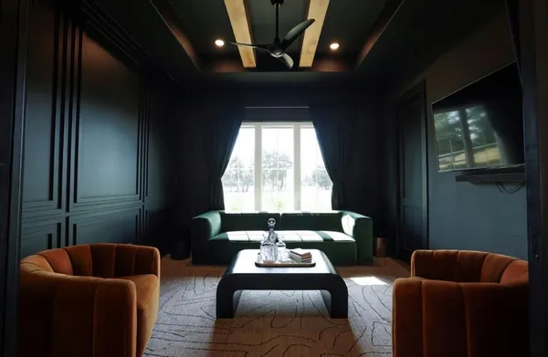 a bathroom with a double vanity sink mirror and bathtub