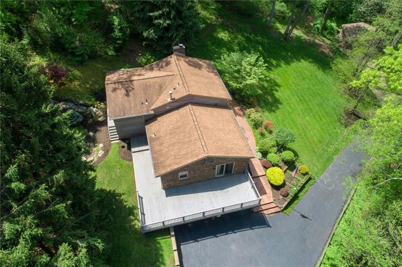 183 Dehaven Road Beaver Falls, PA 15010 - Photo 2 of 23 Home in desirable location situated on 6+ acres that backs to green! Water features include water falls over stone water ways in yard. 2 detached garages, lots of windows for great views of outdoor wonderland.