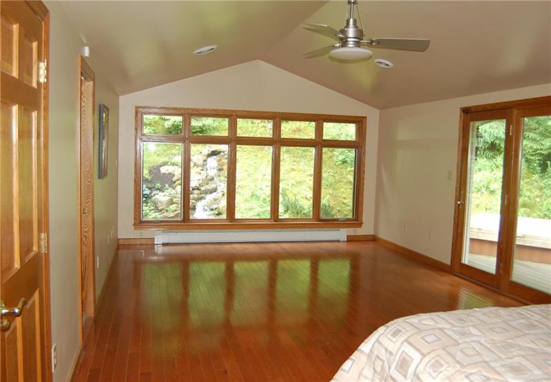 183 Dehaven Road Beaver Falls, PA 15010 - Photo 13 of 23 Master Suite with views of stream and waterfall. Hot tub a step outside doors to right.