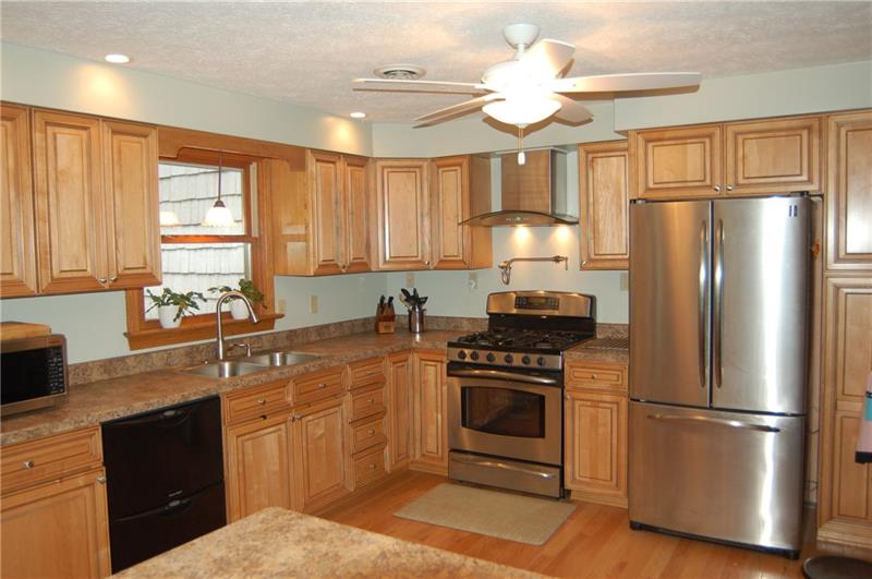 183 Dehaven Road Beaver Falls, PA 15010 - Photo 4 of 23 Kitchen with many details to delight cooks. Notice Pot filler over gas stove.