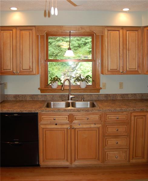 183 Dehaven Road Beaver Falls, PA 15010 - Photo 5 of 23 View a trickling waterfall while standing at double sink. Faucet head detaches for ease of use.