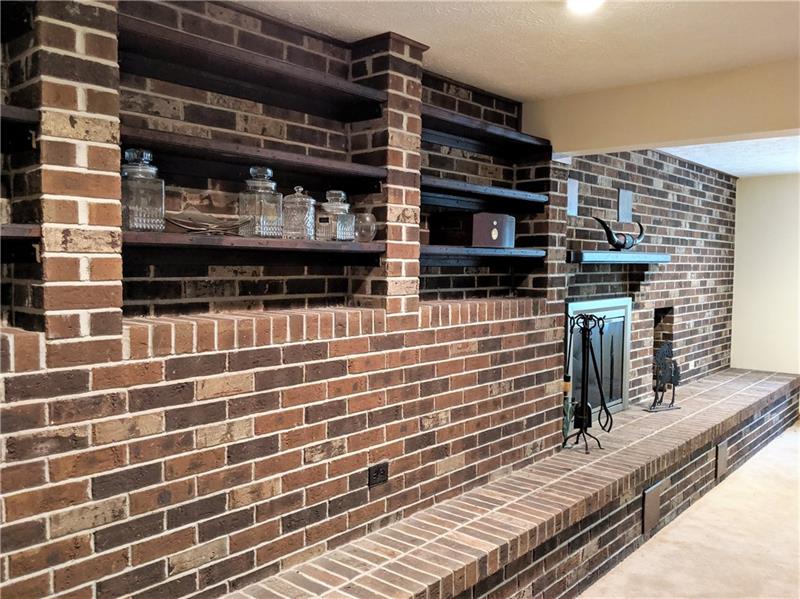 183 Dehaven Road Beaver Falls, PA 15010 - Photo 10 of 23 Family Room on entrance level features all-brick wood burning fireplace. Natural light pours in from front windows.