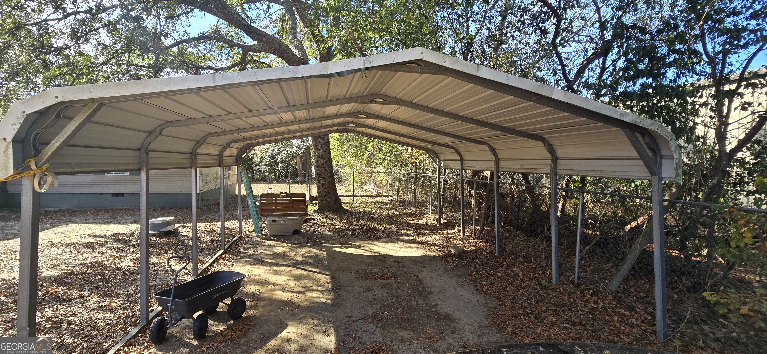 912 Druid Street Dublin, GA 31021 - Photo 11 of 32 a view of a house with a yard