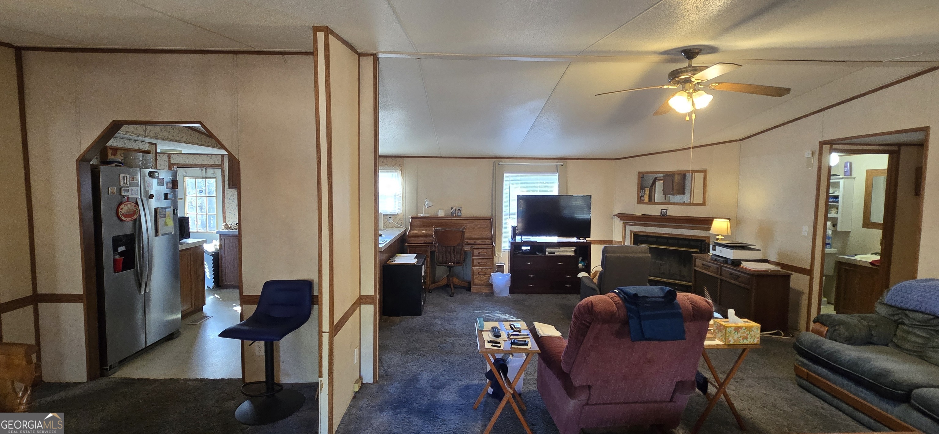 912 Druid Street Dublin, GA 31021 - Photo 13 of 32 a living room with furniture and a flat screen tv