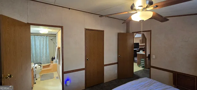 a view of hallway with wooden floor