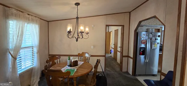 a view of a livingroom with furniture and window