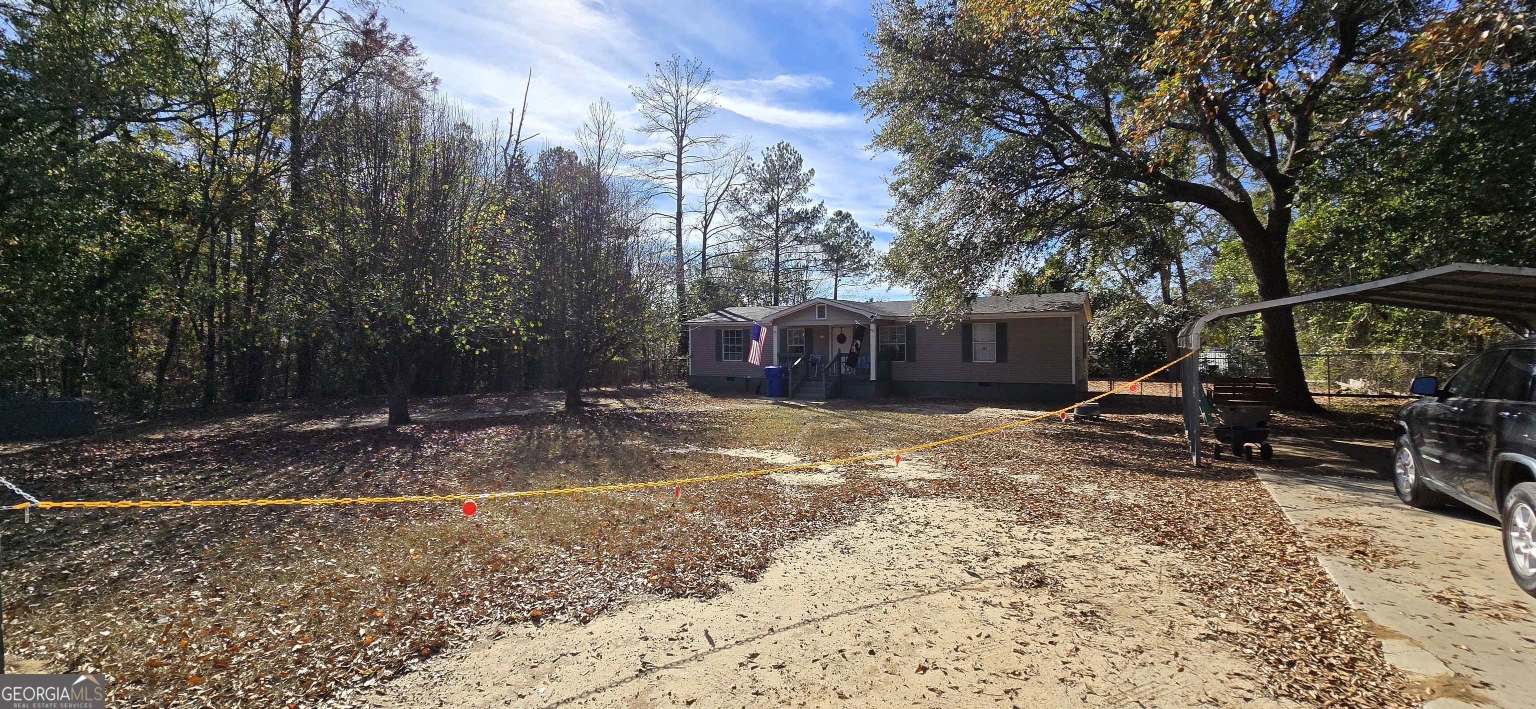 912 Druid Street Dublin, GA 31021 - Photo 5 of 32 a view of a house with backyard and a trees
