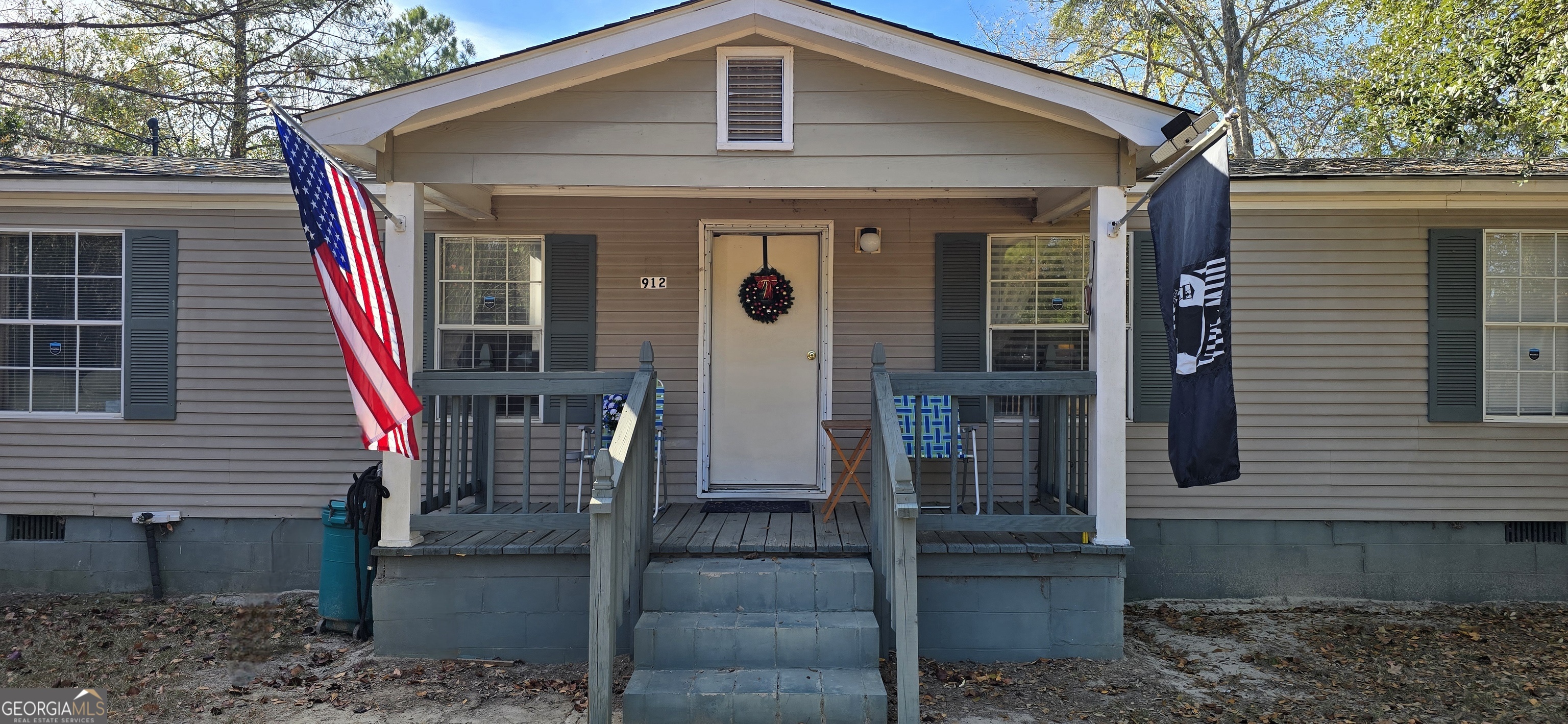 912 Druid Street Dublin, GA 31021 - Photo 6 of 32 a front view of a house with glass windows