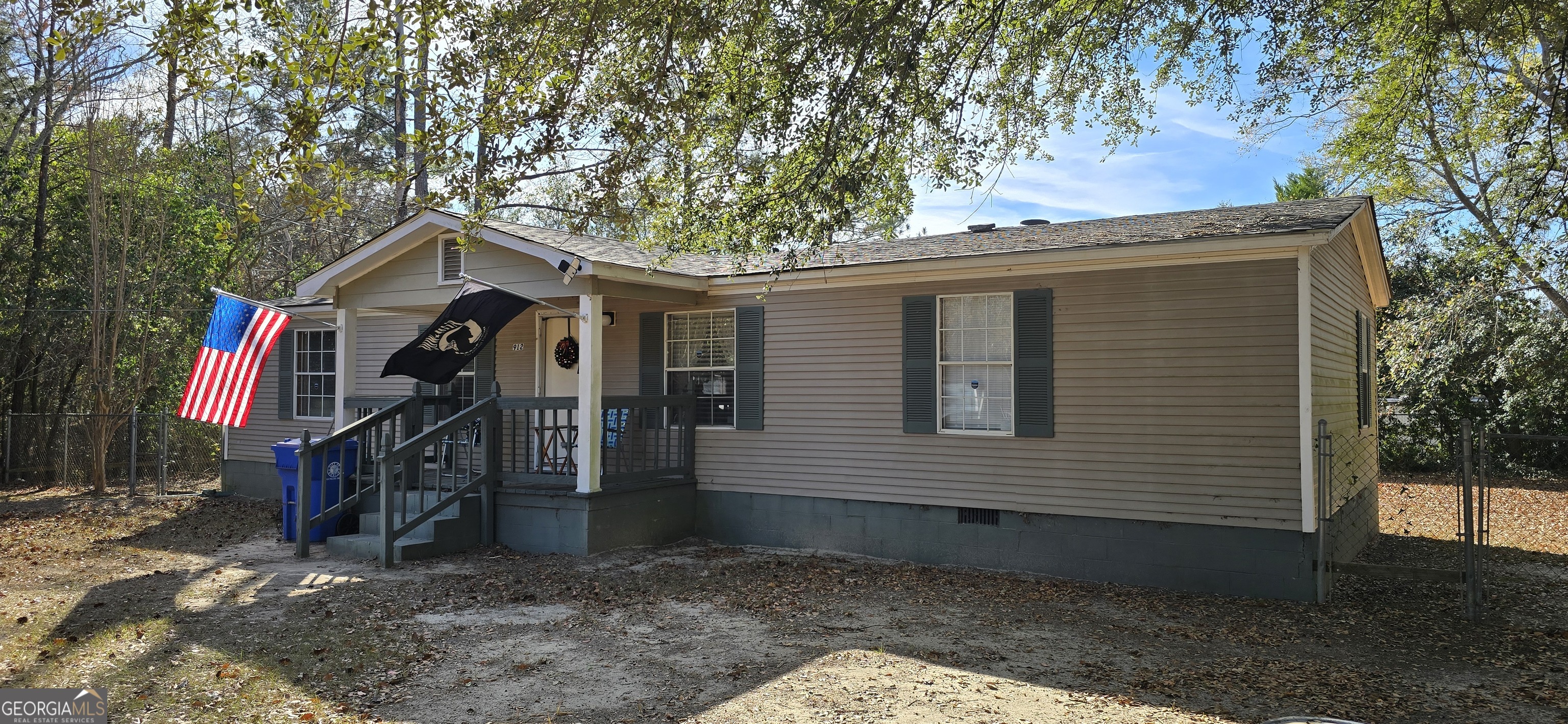 912 Druid Street Dublin, GA 31021 - Photo 8 of 32 a view of a house with a yard