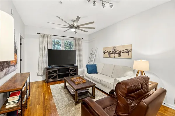 a living room with furniture and a flat screen tv