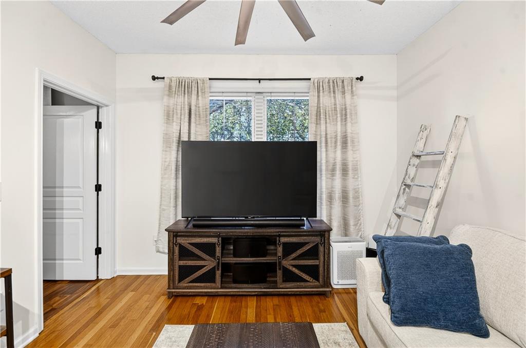 10 Perimeter Summit Boulevard, Unit 4113 Brookhaven, GA 30319 - Photo 13 of 53 a living room with furniture and a flat screen tv