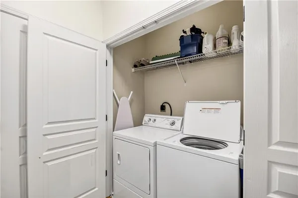a bedroom with a bed and glass window