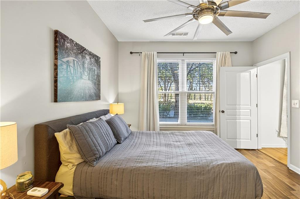10 Perimeter Summit Boulevard, Unit 4113 Brookhaven, GA 30319 - Photo 19 of 53 a bedroom with a bed and a window