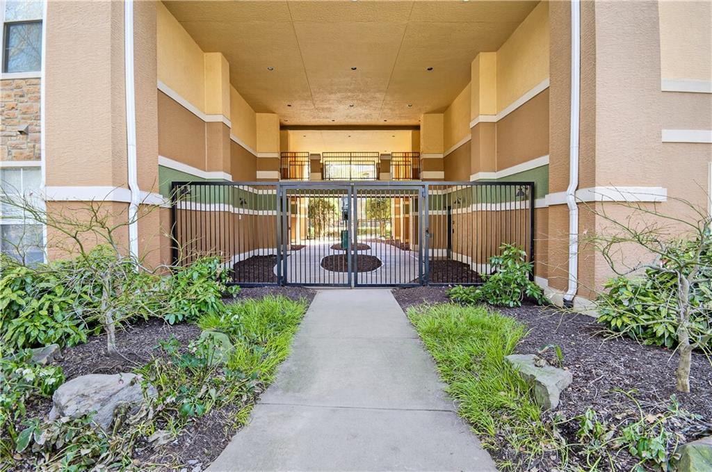 10 Perimeter Summit Boulevard, Unit 4113 Brookhaven, GA 30319 - Photo 2 of 53 a view of a patio with furniture and garden