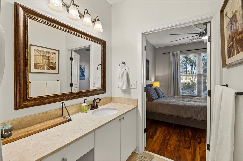 10 Perimeter Summit Boulevard, Unit 4113 Brookhaven, GA 30319 - Photo 24 of 53 a en suite bathroom with a double vanity sink and a mirror