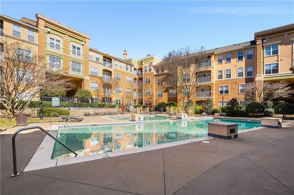 a view of pool with outdoor seating