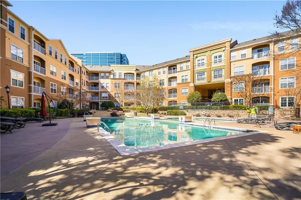 a front view of building with yard