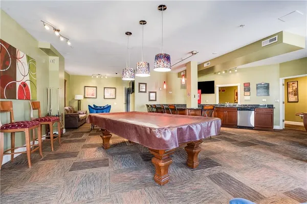 a large kitchen with stainless steel appliances lots of counter top space
