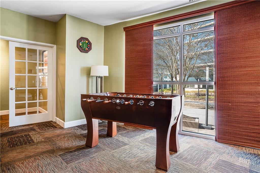 10 Perimeter Summit Boulevard, Unit 4113 Brookhaven, GA 30319 - Photo 34 of 53 a view of a livingroom with furniture and window