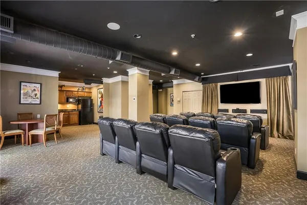 a front view of a building with a fountain