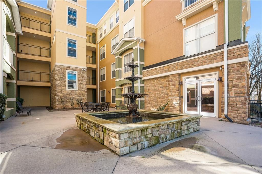 10 Perimeter Summit Boulevard, Unit 4113 Brookhaven, GA 30319 - Photo 36 of 53 a front view of a building with a fountain