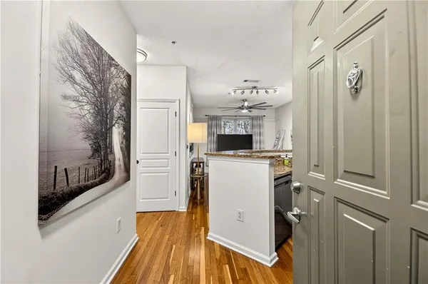 a kitchen with refrigerator and window
