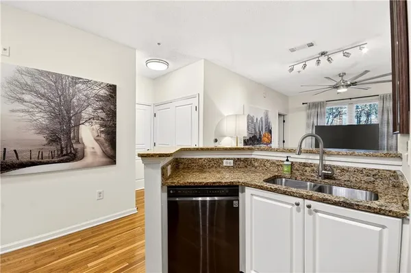 a kitchen with a sink and a refrigerator