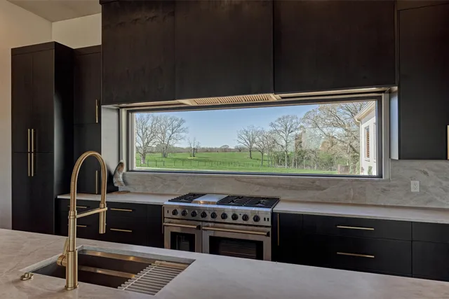 a kitchen with a stove and a refrigerator