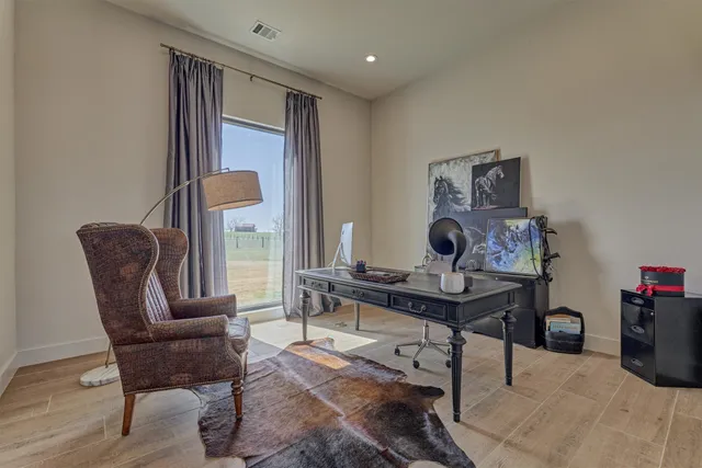 a workspace with furniture and wooden floor