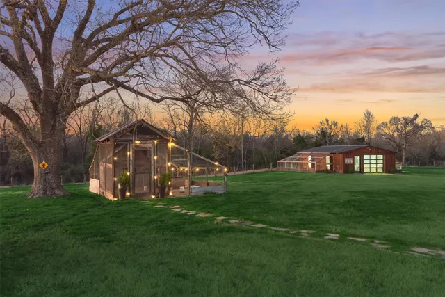 a view of a field of the front of the house