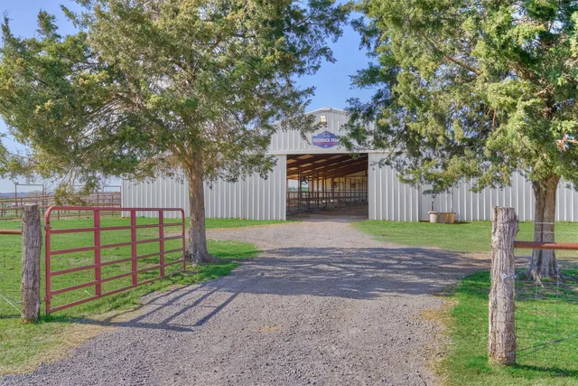 a sign board with a yard