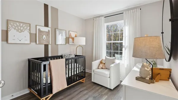 a bedroom with furniture and a window