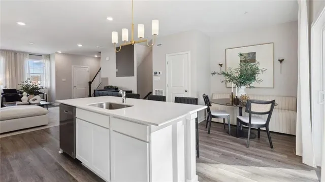 a kitchen that has a table and chairs in it