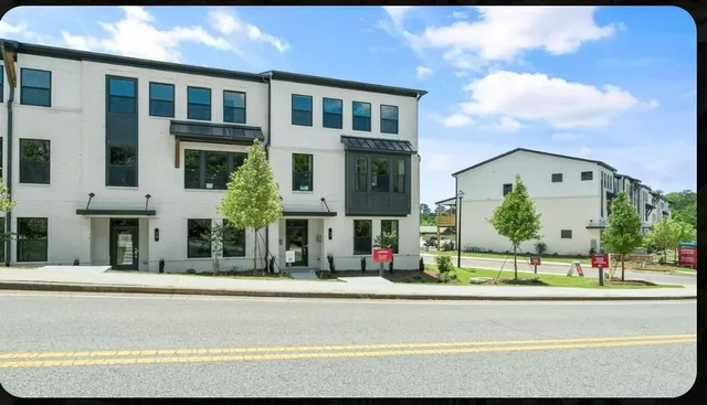 a front view of building with street sign