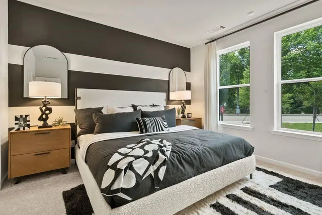 a bedroom with a bed and window