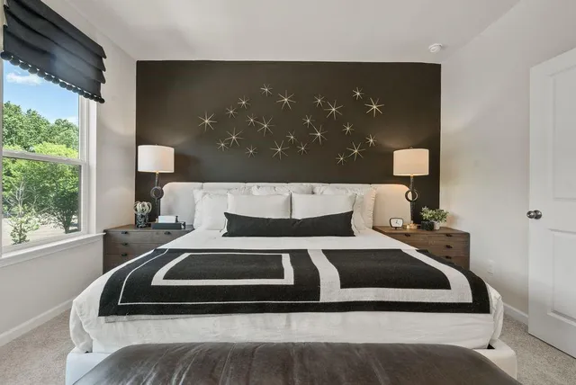 a bedroom with a bed and window