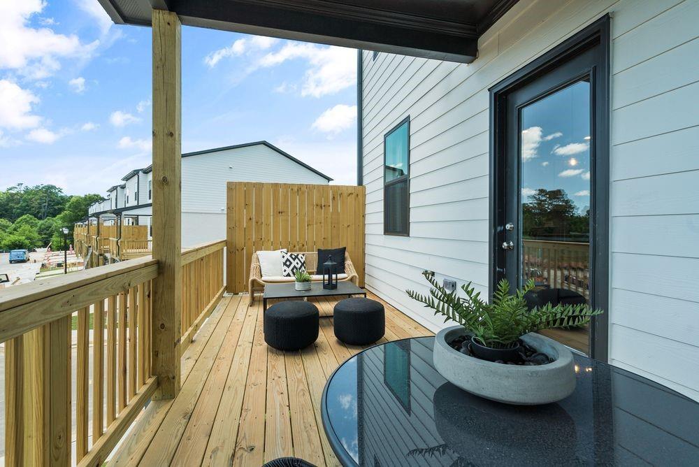 36 Peeples Drive Lawrenceville, GA 30046 - Photo 26 of 30 a view of a balcony with chairs and a potted plant