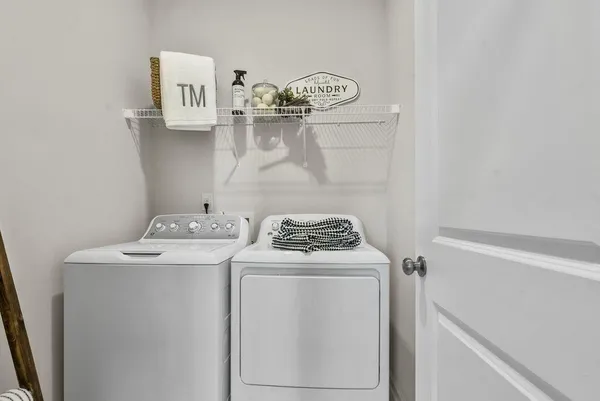 a view of storage and utility room with washer and dryer