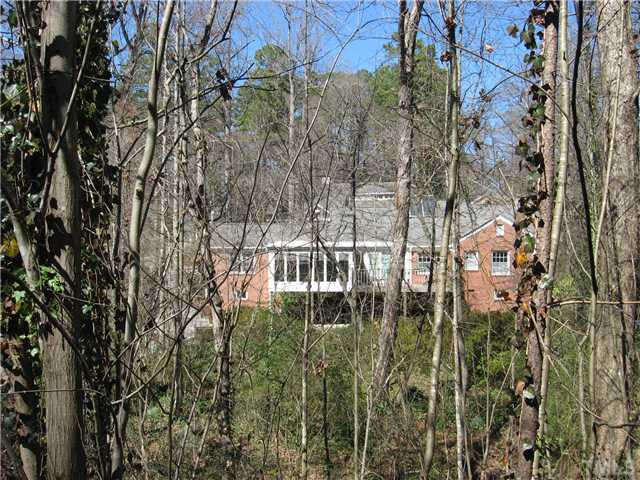 719 Runnymede Road Raleigh, NC 27607 - Photo 4 of 25 View of house from the back of the large priviate back yard. Exterior Back
