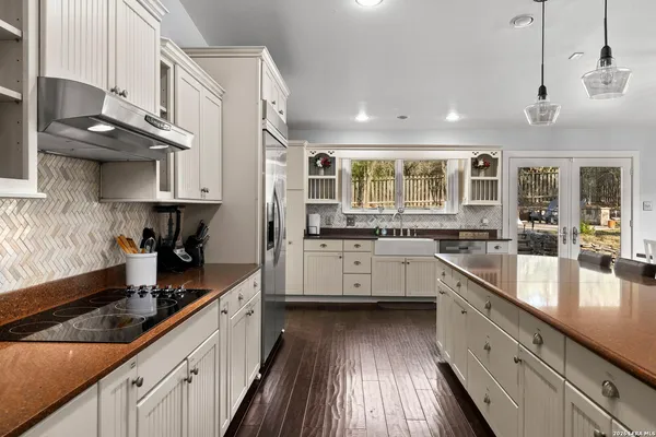 a kitchen with a sink cabinets and window