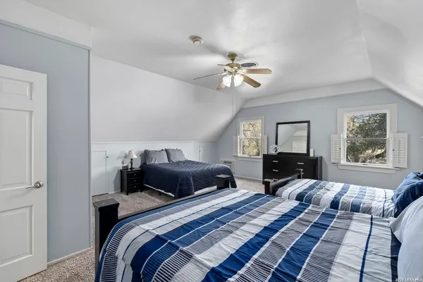 a view of a house with swimming pool and sitting area