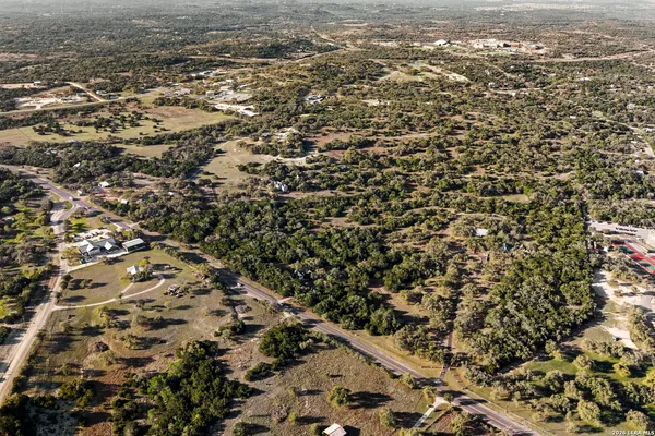 an aerial view of a house with a tree