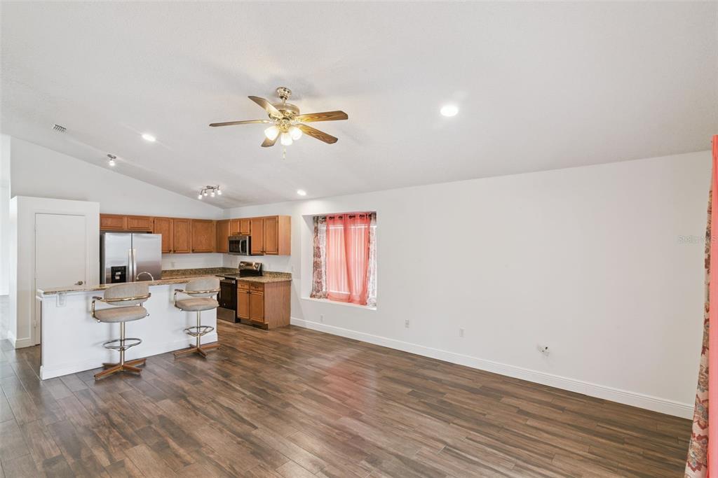 2732 Cahill Way Lake Mary, FL 32746 - Photo 11 of 20 a living room with furniture and a wooden floor