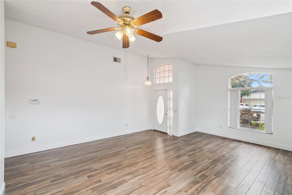 2732 Cahill Way Lake Mary, FL 32746 - Photo 12 of 20 wooden floor in an empty room with a window