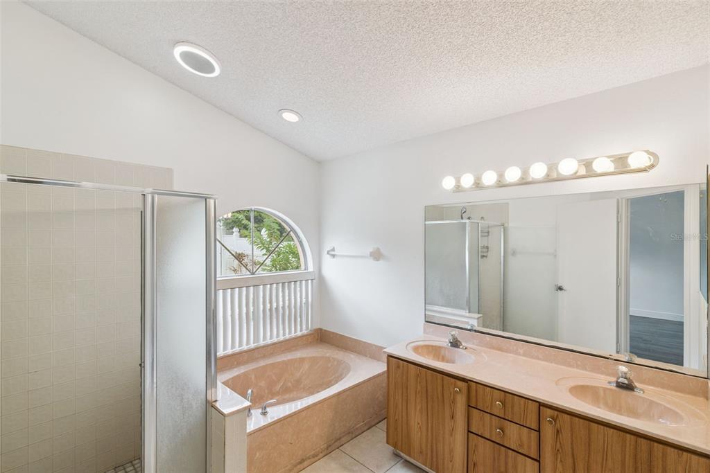 2732 Cahill Way Lake Mary, FL 32746 - Photo 14 of 20 a bathroom with a sink and a bathtub