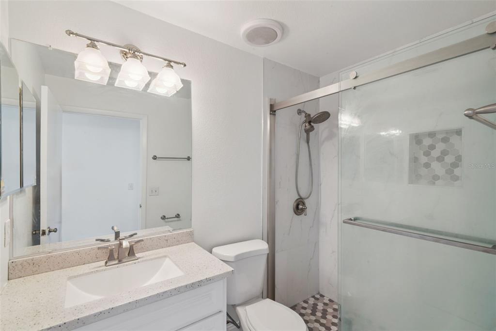 2732 Cahill Way Lake Mary, FL 32746 - Photo 19 of 20 a bathroom with a sink a toilet and shower