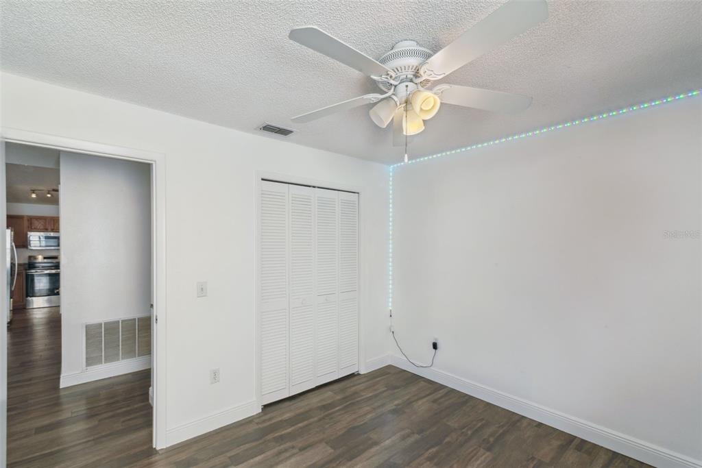 2732 Cahill Way Lake Mary, FL 32746 - Photo 10 of 20 a view of an empty room with wooden floor